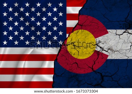 United States flag weaving texture with  flag of Colorado on cracked ground, concept of state drought.