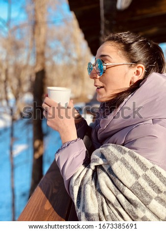 a girl having latte coffee with marshmallow