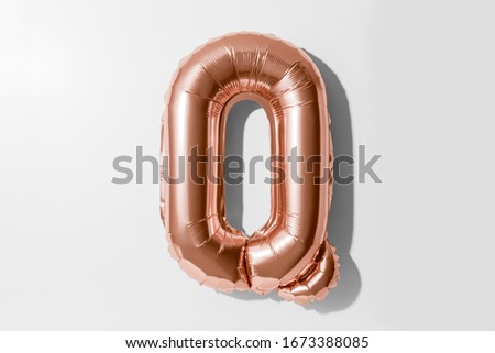 Letter Q, Rose gold foil balloon alphabet isolated on a white background with Clipping Path