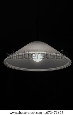 Chandelier with a lamp on a dark background. Web banner.