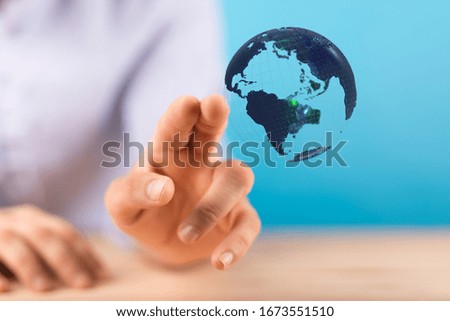 Human Hand Holding The World In Hands
