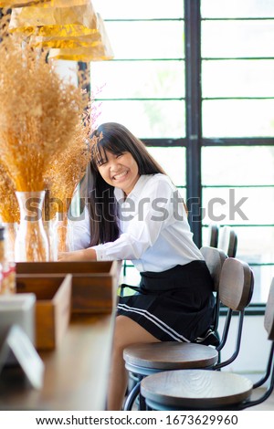 asian teenager toothy  smiling wiht happiness face