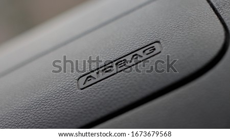The picture shows a normal car airbag. Royalty-Free Stock Photo #1673679568