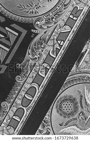 Large inscription "dollar" on the diagonal of the picture. Composition of 1 dollar American bills. Inverted black and white photo. US economy, Fed, refinancing rate. Vertical shot. Macro