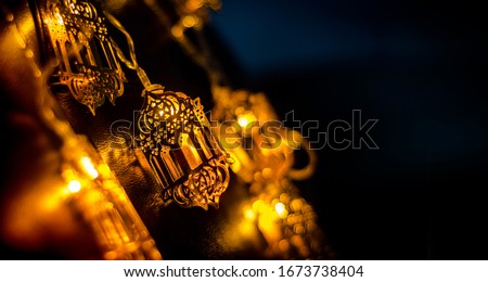 Ramadan and Eid al fitr Decoration Background 2024, Beautiful Yellow Color Arabic Traditional lantern light lamp, Islamic Decoration concept image Eid Mubarak, Yellow out of Focus Image