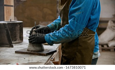Concrete industry - worker preparing the form for working with concrete