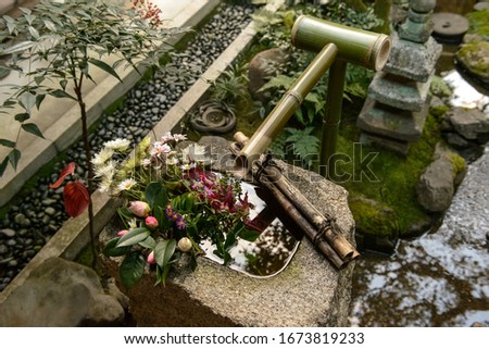 The sacred spring of bamboo decorated with flowers