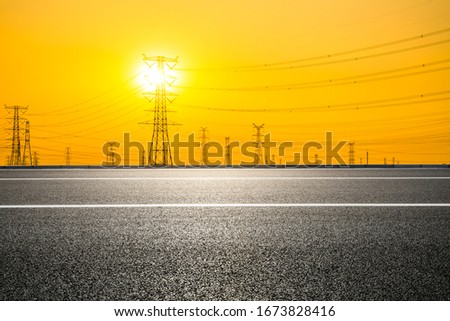 Asia empty asphalt road and power tower nature landscape at summer sunset