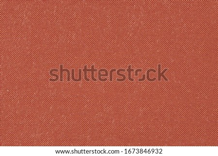Macro image showing fine texture of deep red colored ink on paper