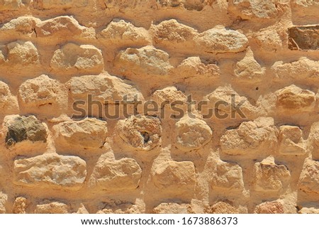 Texture stone of the wall found during excavations Texture of old sandstone brickwork. Background of retro masonry brick of limestone.