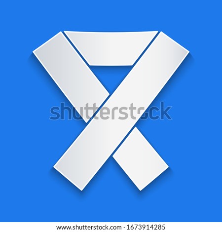 Paper cut Awareness ribbon icon isolated on blue background. Public awareness to disability, medical conditions and health. Paper art style. Vector Illustration