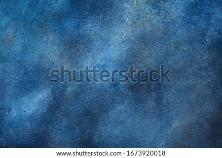 Texture of navy blue color painted wall background. 