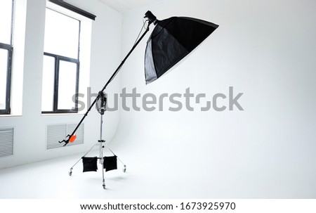 Empty photo studio with professional lighting equipment isolated on the white background. Space for text. 