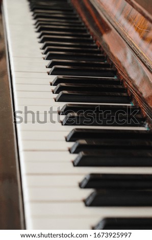 old piano keyboard vintage retro style brown and red color. 