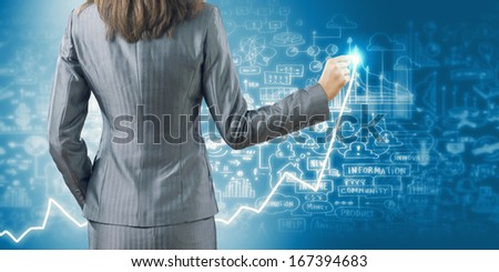 Back view of businesswoman drawing business strategy sketch