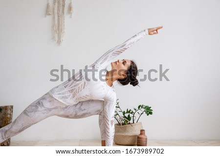 Woman are doing yoga in home. Royalty-Free Stock Photo #1673989702