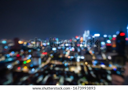 Blurred abstract background lights, beautiful cityscape view of Kuala lumpur city skyline at night in Malaysia.