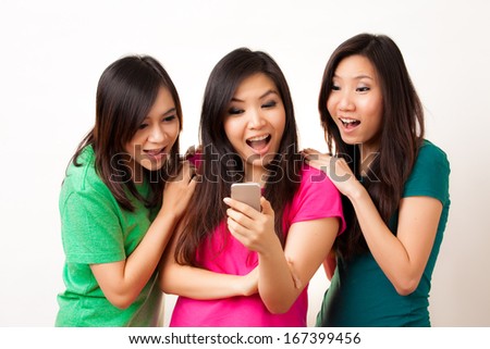 Group of Asian people enjoy their phone