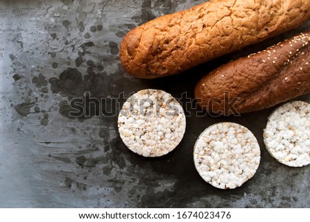 Gluten free food. Different types of gluten free bread. An alternative to wheat bread. Buckwheat baguette, rice crackers. Nutrition concept for people with gluten intolerance.