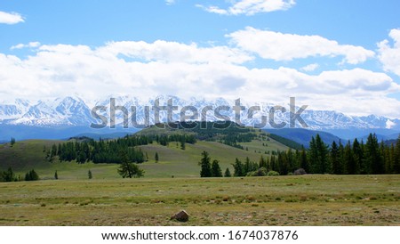 Mountain valley landscape. Breathtaking scenery. Snow peaks.