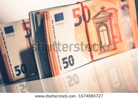 Euro Cash Money Stack on White Glassy Surface. Closeup Photo. Business and Economy. 