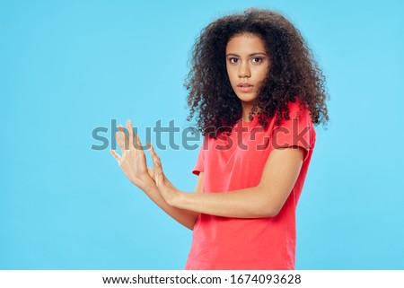 Pretty emotional woman curly hair hand gesture Studio lifestyle