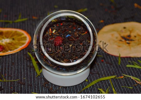 
black tea with herbs and dried berries