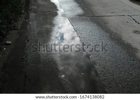 a clouded sky reflected in the water