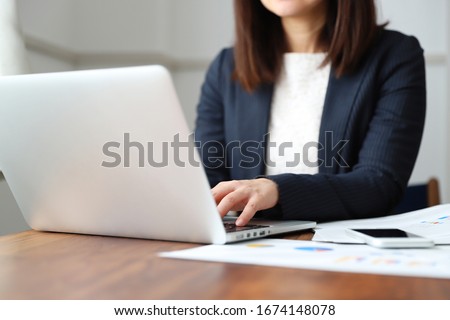 A woman in a suit doing telework at home Royalty-Free Stock Photo #1674148078