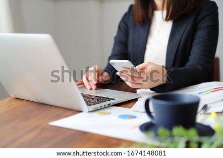 A woman in a suit doing telework at home Royalty-Free Stock Photo #1674148081