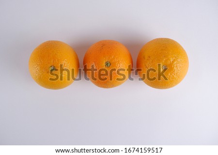 Fresh orange fruit on wooden white background