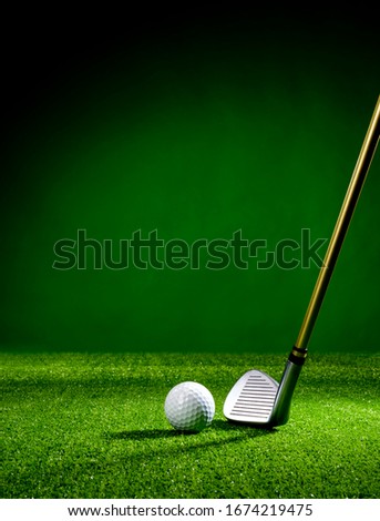 Golf club and golf ball on the turf