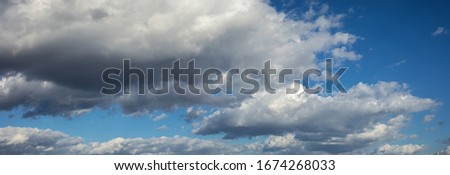 Beautiful blue sky background panorama at daylight with white cumulus clouds. Backgroud banner