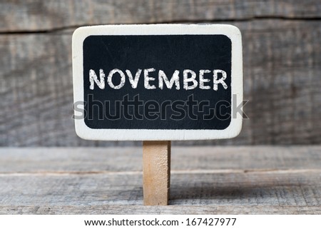 November on Small wooden framed blackboard with wooden background 