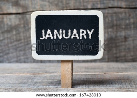 January on Small wooden framed blackboard with wooden background 