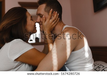 Young girl kissing her boyfriend