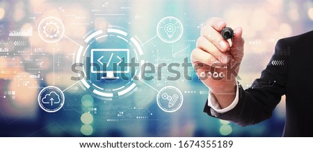 Web development concept with businessman on blurred abstract background