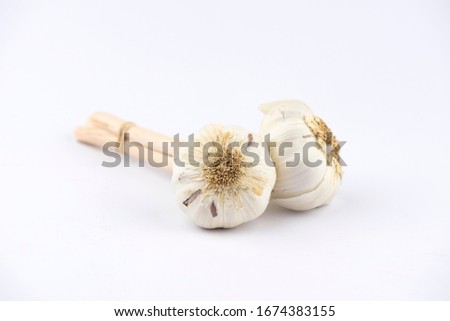Garlic: a real pill with anti-inflammatory, antibiotic, anti-impotence, heart saver and low pressure properties. Royalty-Free Stock Photo #1674383155