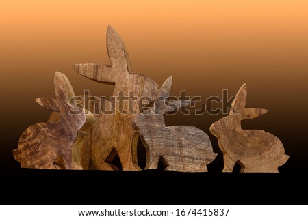 Easter decoration with Easter bunnies carved from wood