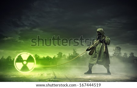 Man in respirator against nuclear background. Radioactivity concept
