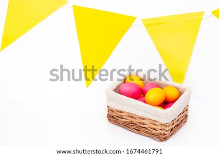 Easter eggs in the basket. Happy easter. painted eggs on a light background.