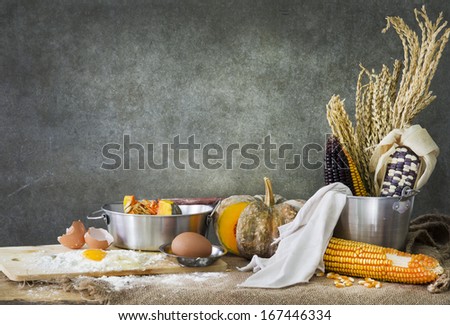 still life food, making a cake with pumpkin,corn and grain
