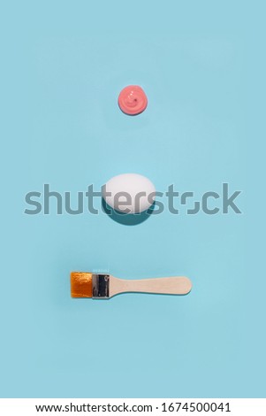 Prepared workplace for coloring eggs. Modern easter concept on the blue background