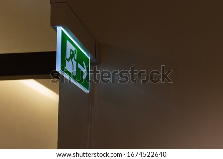escape sign with green color  in a historical building in south germany