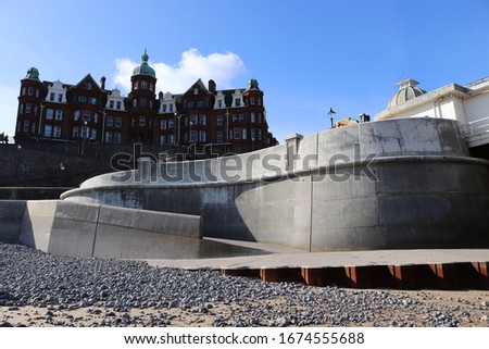 Cromer Sea defence in foreground with seaside hotel pictured behind.