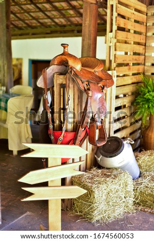 country farm decor with milk drums horse saddle hay palletes with space for text
