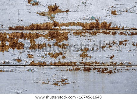 Color photo of metal surfaces with rust and paint