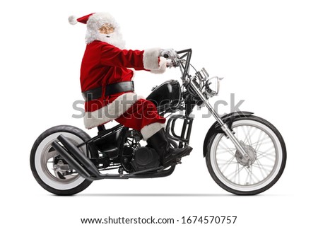 Santa Claus riding a chopper motorbike isolated on white background