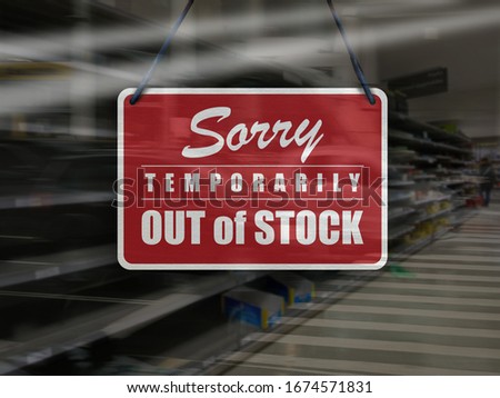 Business concept of empty store shelves with 'Sorry, Temporarily Out of Stock' sign.