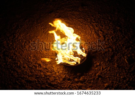 Bowl campfire burning at night during a roadtrip in Croatia.